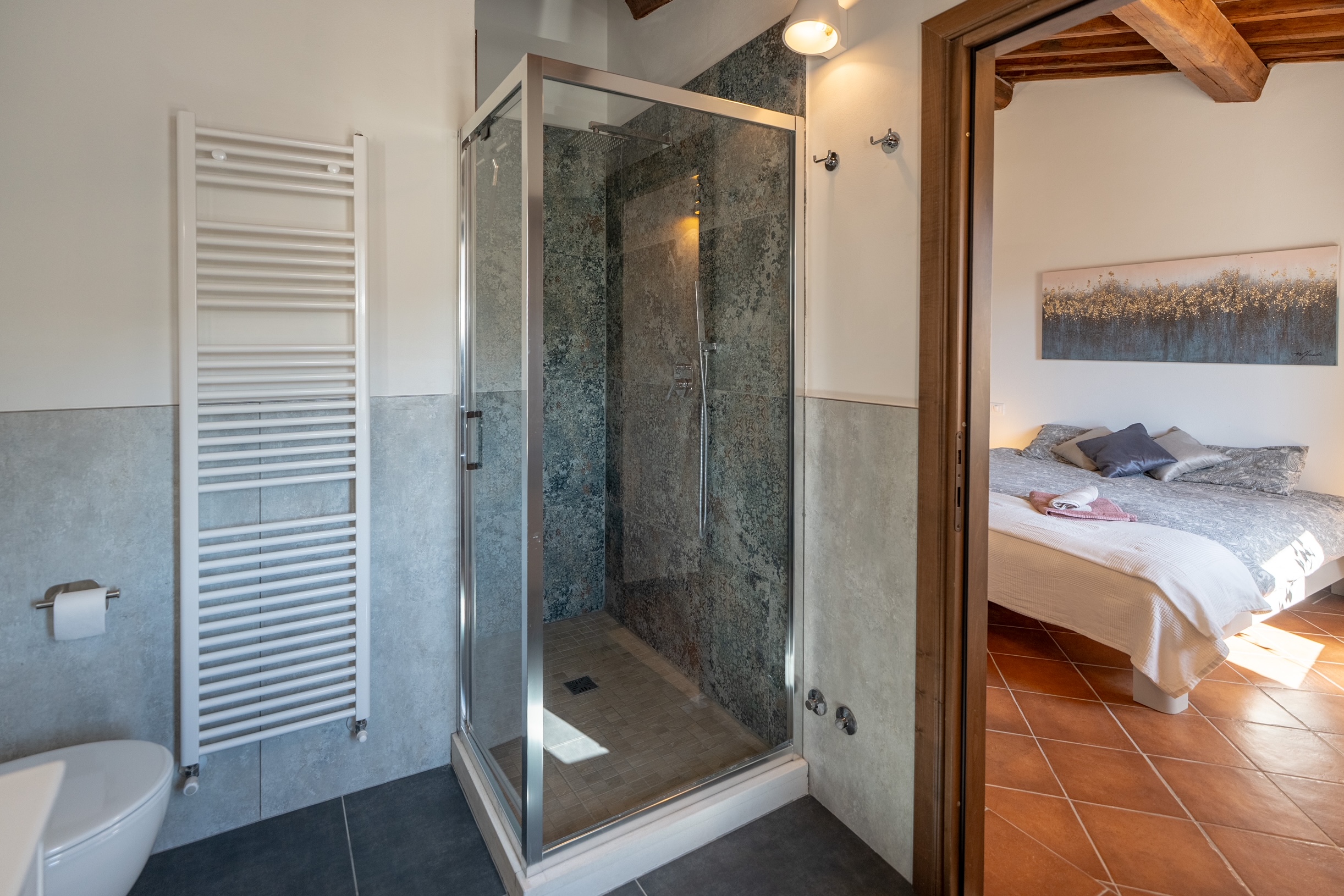 En-suite shower bathroom with view through to bedroom