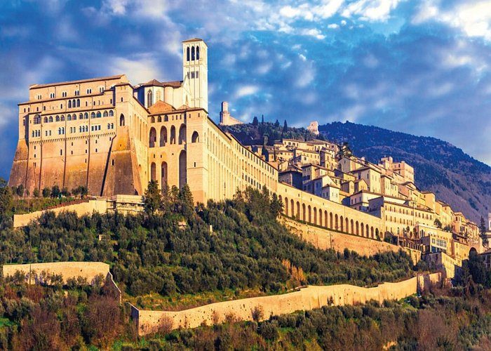Assisi rising above the Umbrian plain at golden hour