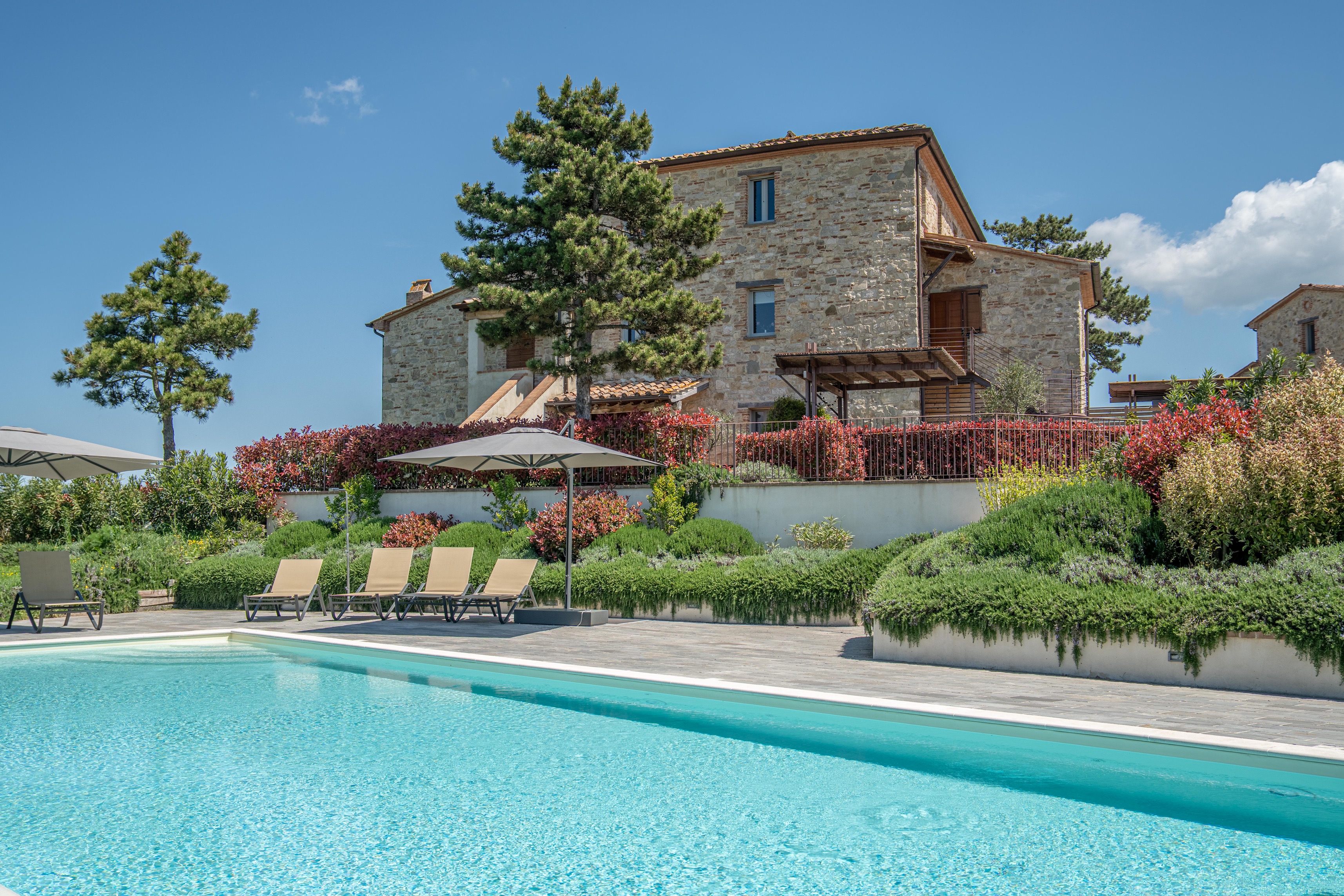 Casa Luna estate aerial view — stone villa, pool and Umbrian hills